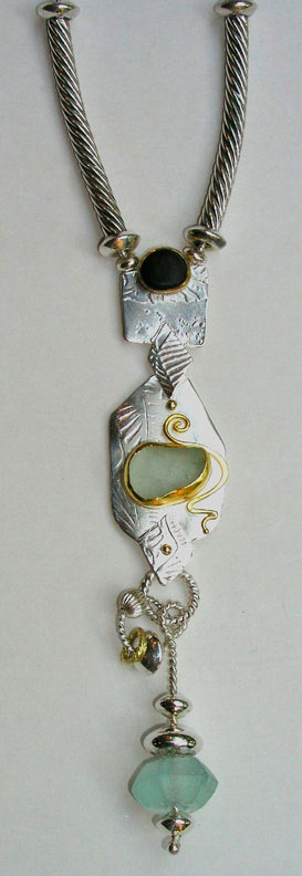 Sterling, 18  and 22 Kt. Gold with Etching, Roller Printing
Oregon Beach stone, Mediterranean Sea Glass, Arabian Glass Bead